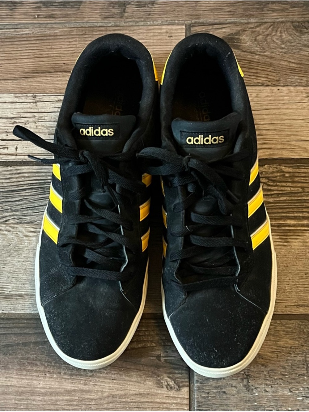 adidas Black Sneakers with Yellow Three-Stripe Detail